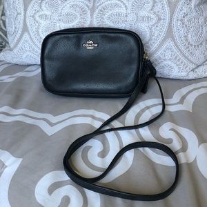 Coach all leather crossbody purse.